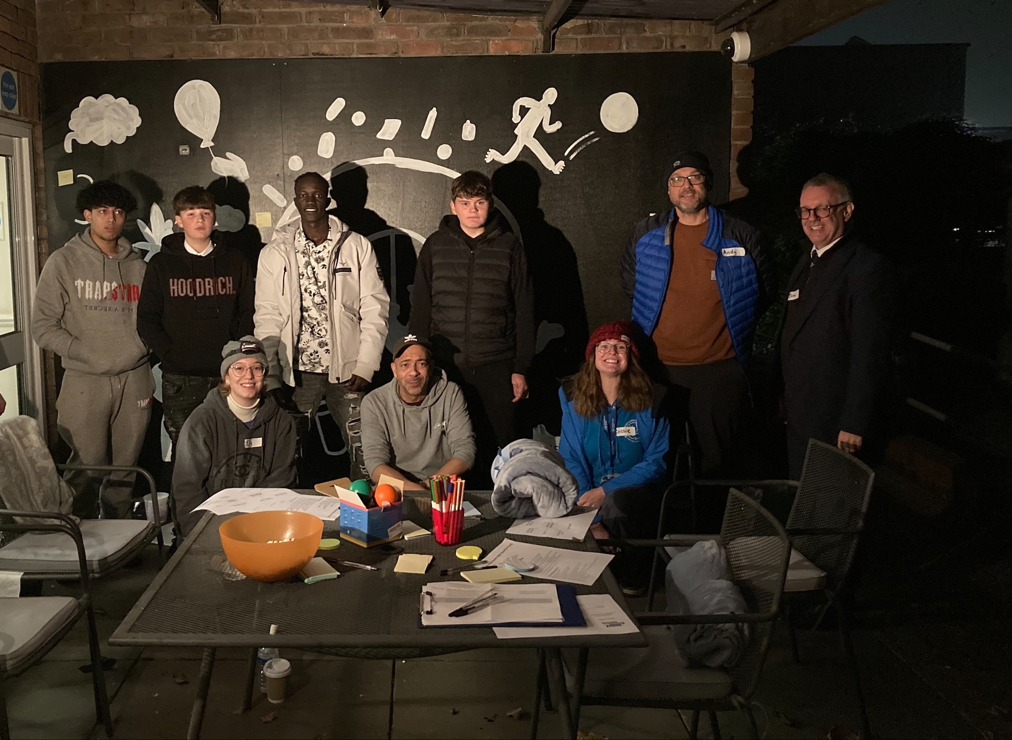 group photo in front of blackboard